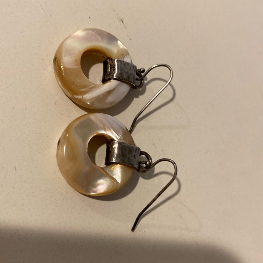 Hoop earrings with cream colored stone